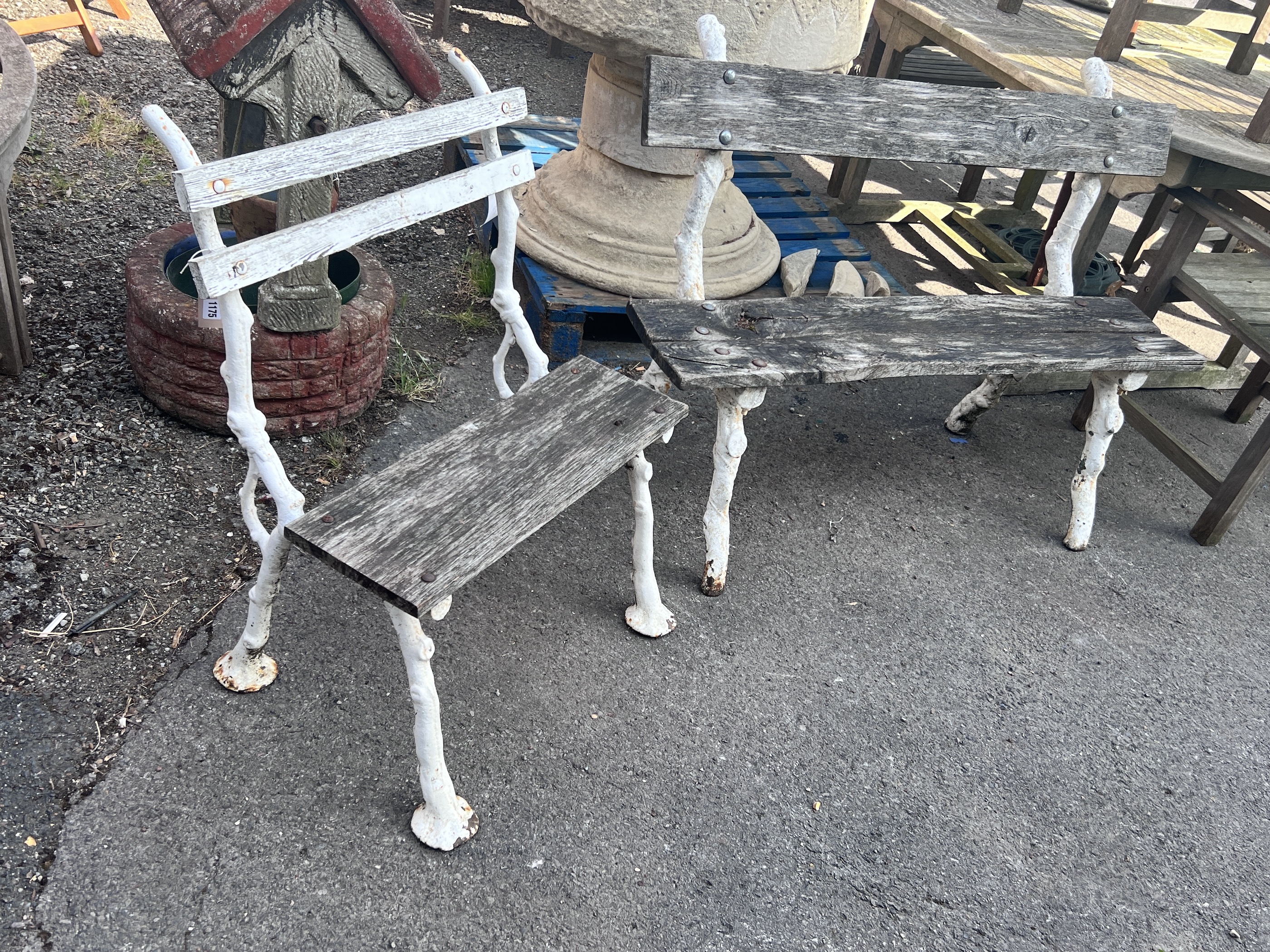 A Victorian Coalbrookdale style 'rustic' cast iron garden bench, larger width 119cm, height 87cm and a chair